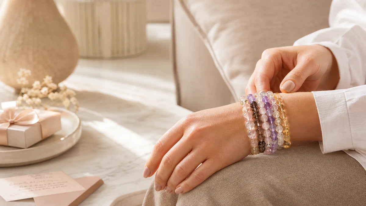 Everyday crystal bracelet stack worn with a soft neutral QZENI lifestyle setting