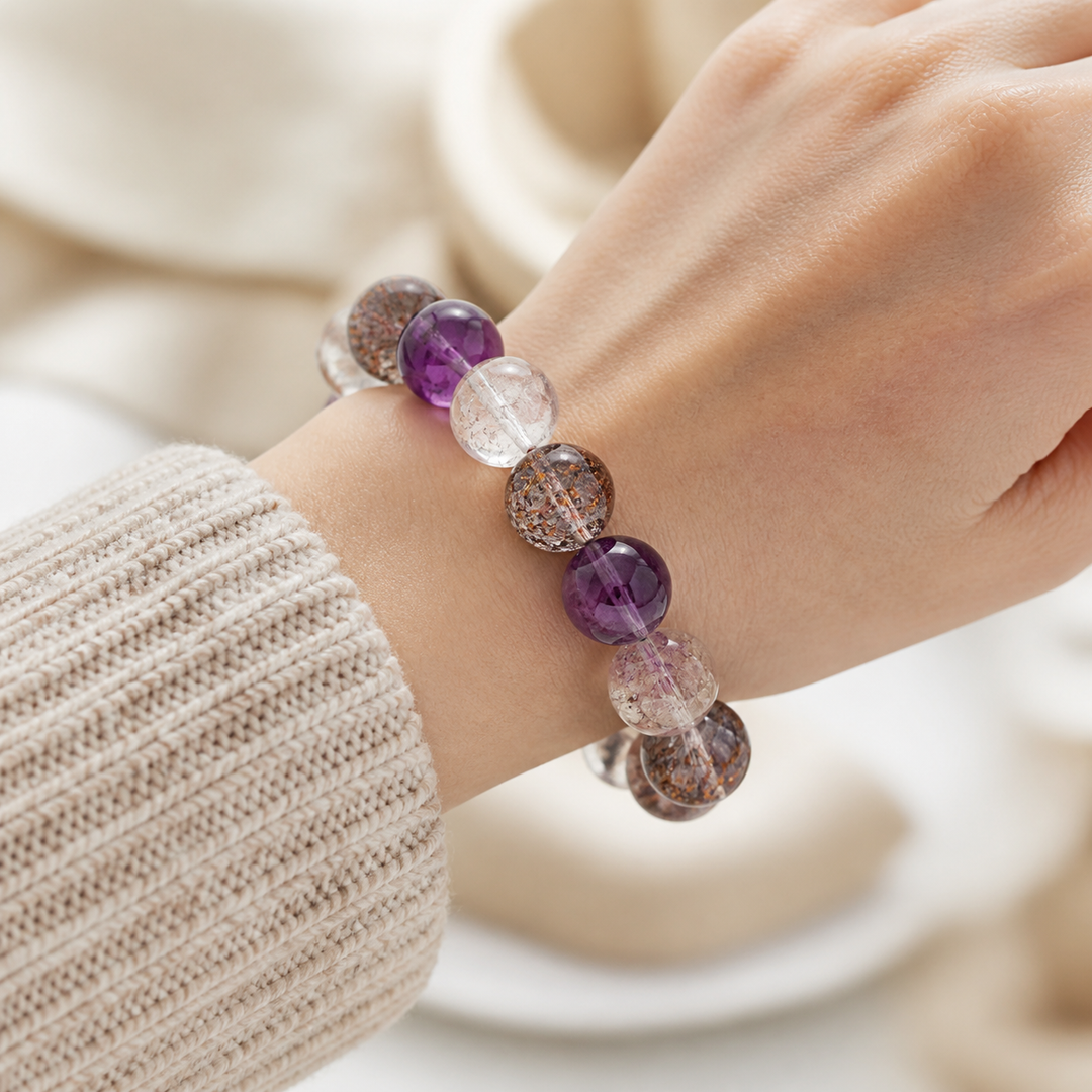 Wearing close-up on American woman wrist for 14mm Multi-Stone Crystal Bracelet with Amethyst, Clear Quartz, Super Seven | QZENI crystal bracelet