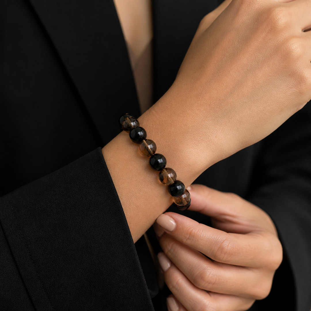 Wearing close-up on American woman wrist for 12mm Obsidian & Smoky Quartz Bracelet | QZENI crystal bracelet